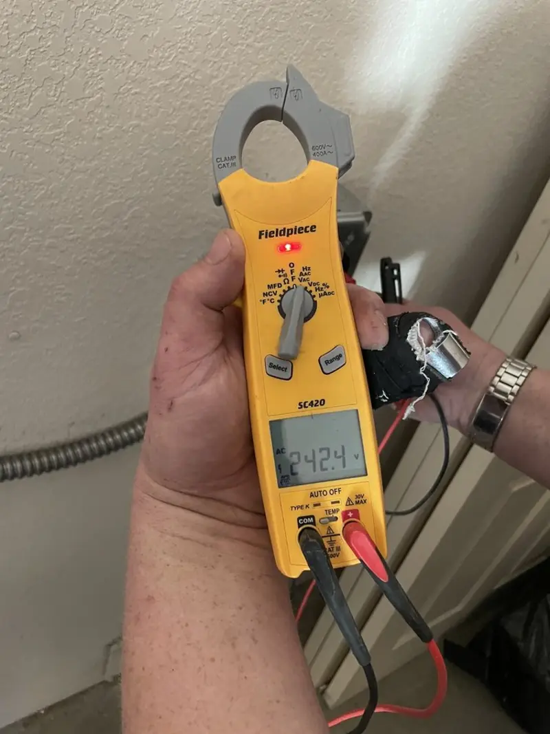 Voltage testing with clamp meter during Whole House Surge Protector in Kokomo